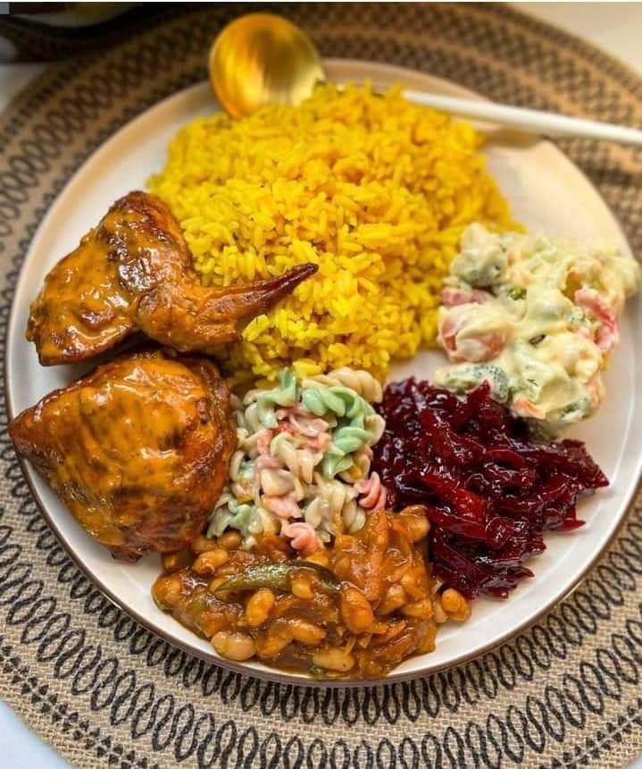 Glazed chicken with yellow rice and salads