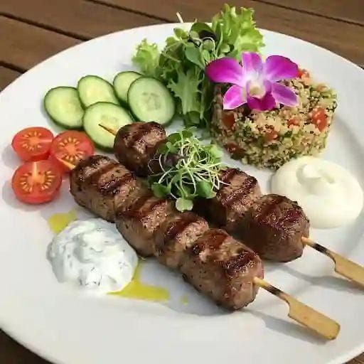 Lamb kebabs with couscous and fresh salad